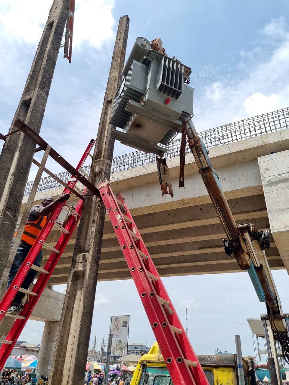 Lifting a transformer onto a pole structure