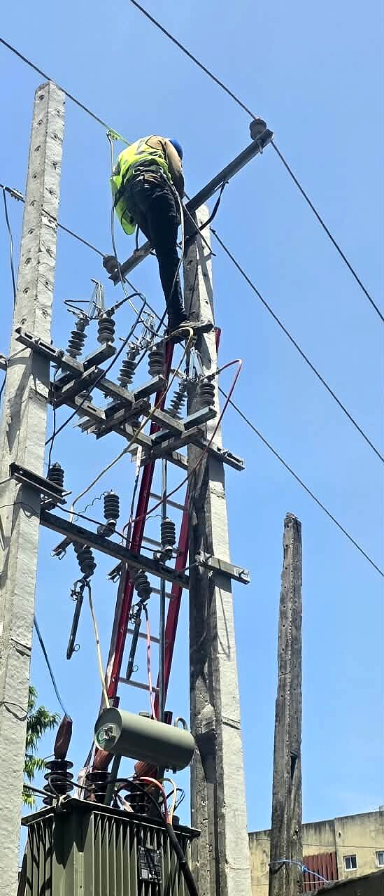 Line work at the top of a transformer pole