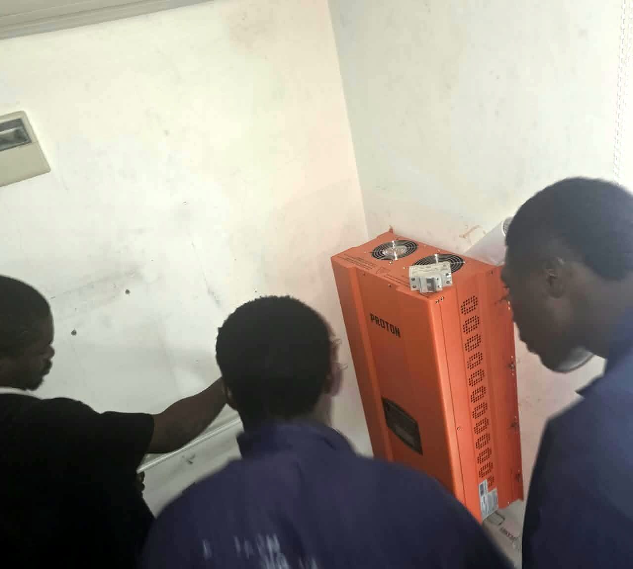 Crew installing a battery unit